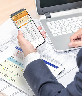 businessman-holding-smartphone-tablet-pc