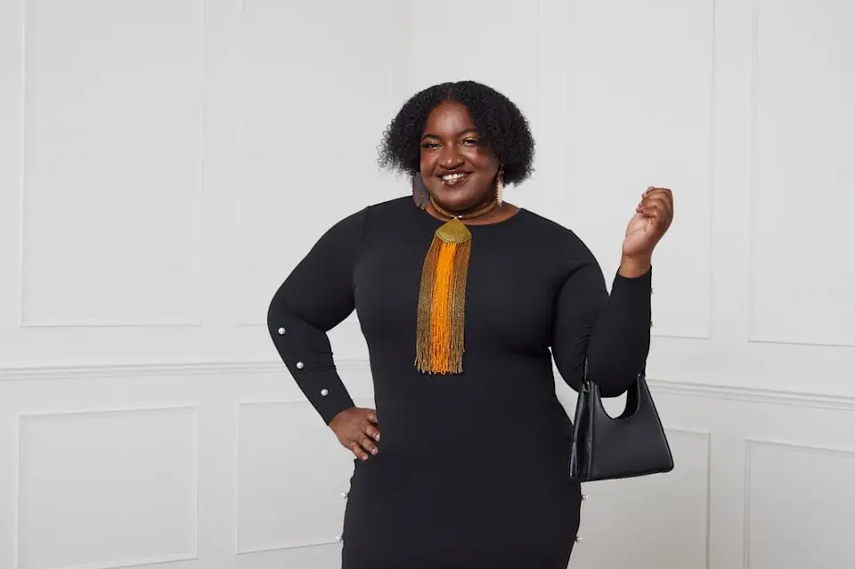 Toni-Ann Gurdon, DfSGL Client of the Year 2024, models the SHEIN Curve Collection, in partnership with Dress for Success Greater London