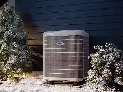 an-hvac-installation-outside-of-a-home-in-winter.jpg.avif