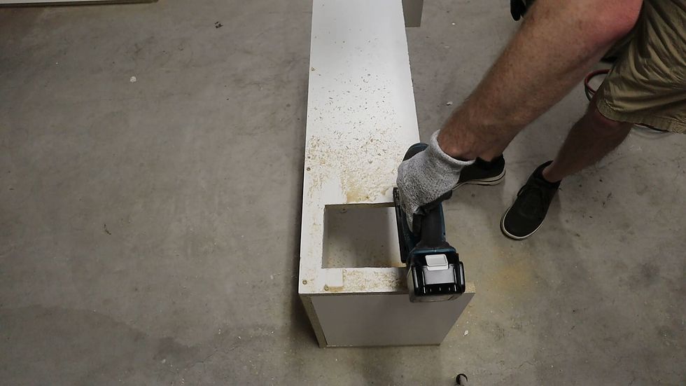 cutting a hole for the cats to go to the litter box