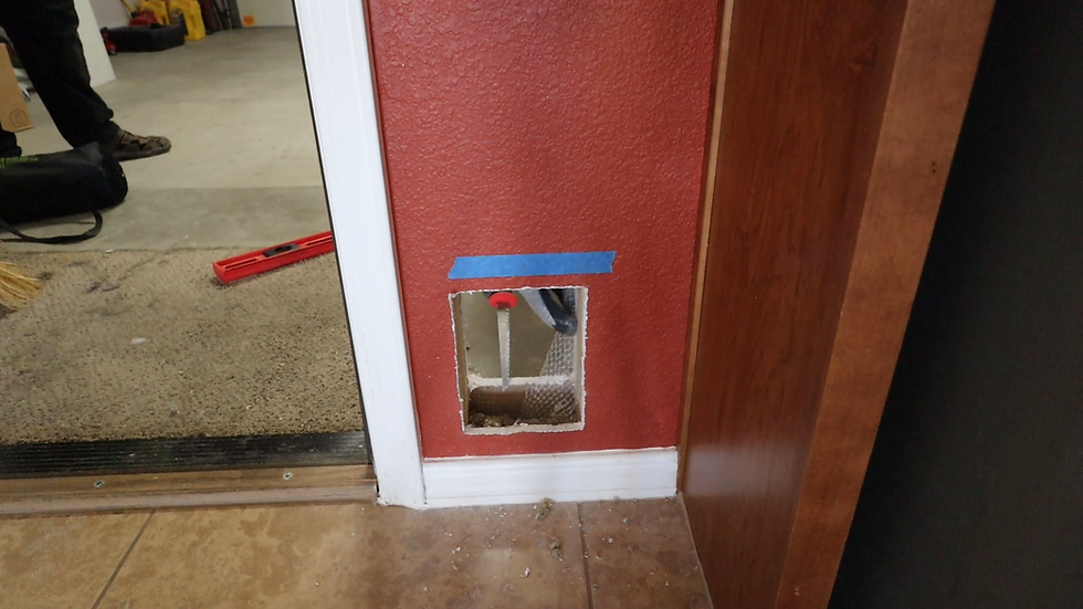 cutting a hole in the wall for the cats to get to the litter box