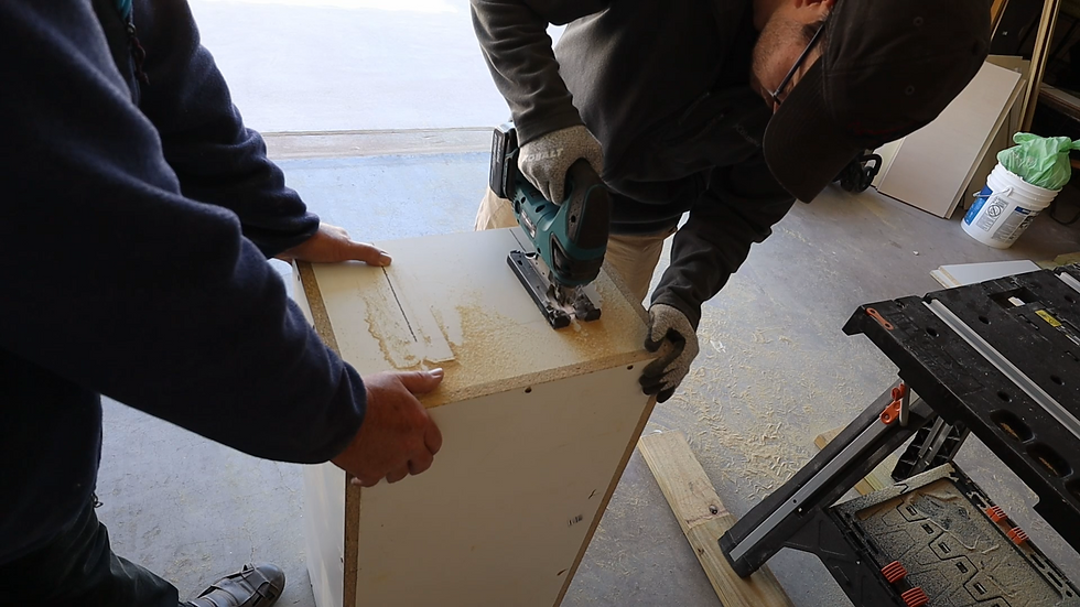 cutting a hole for the access run to the litter box