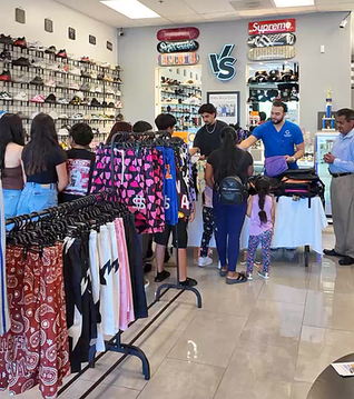 Shoe store hosts backpack giveaway