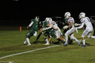 Hawks hang on for playoff win