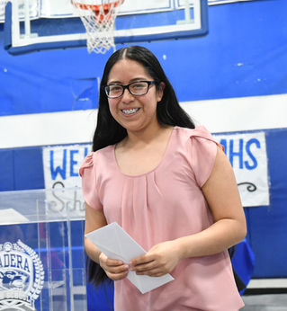 Determination leads to graduation for farm worker-head of her family