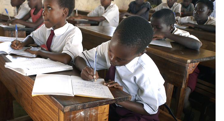 Children are in a classroom learning in East Africa.