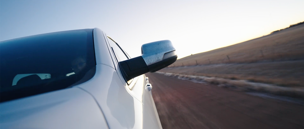 car mounted shot side mirror – still from “DriveSafe,” a video created with Patterson-UTI to promote safer driving