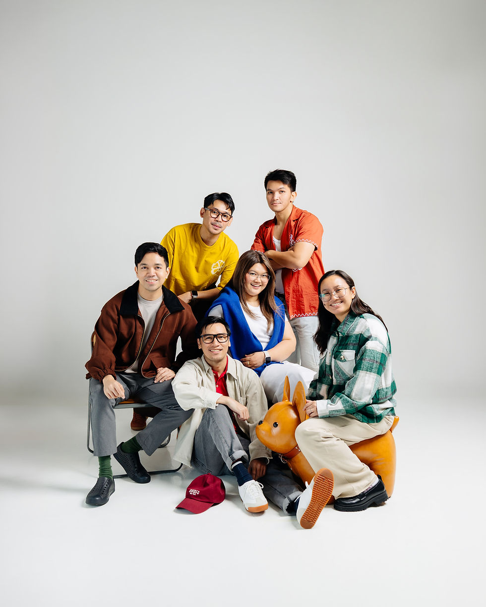 A group portrait of the six team members behind DropBy Studio, posing together in casual attire