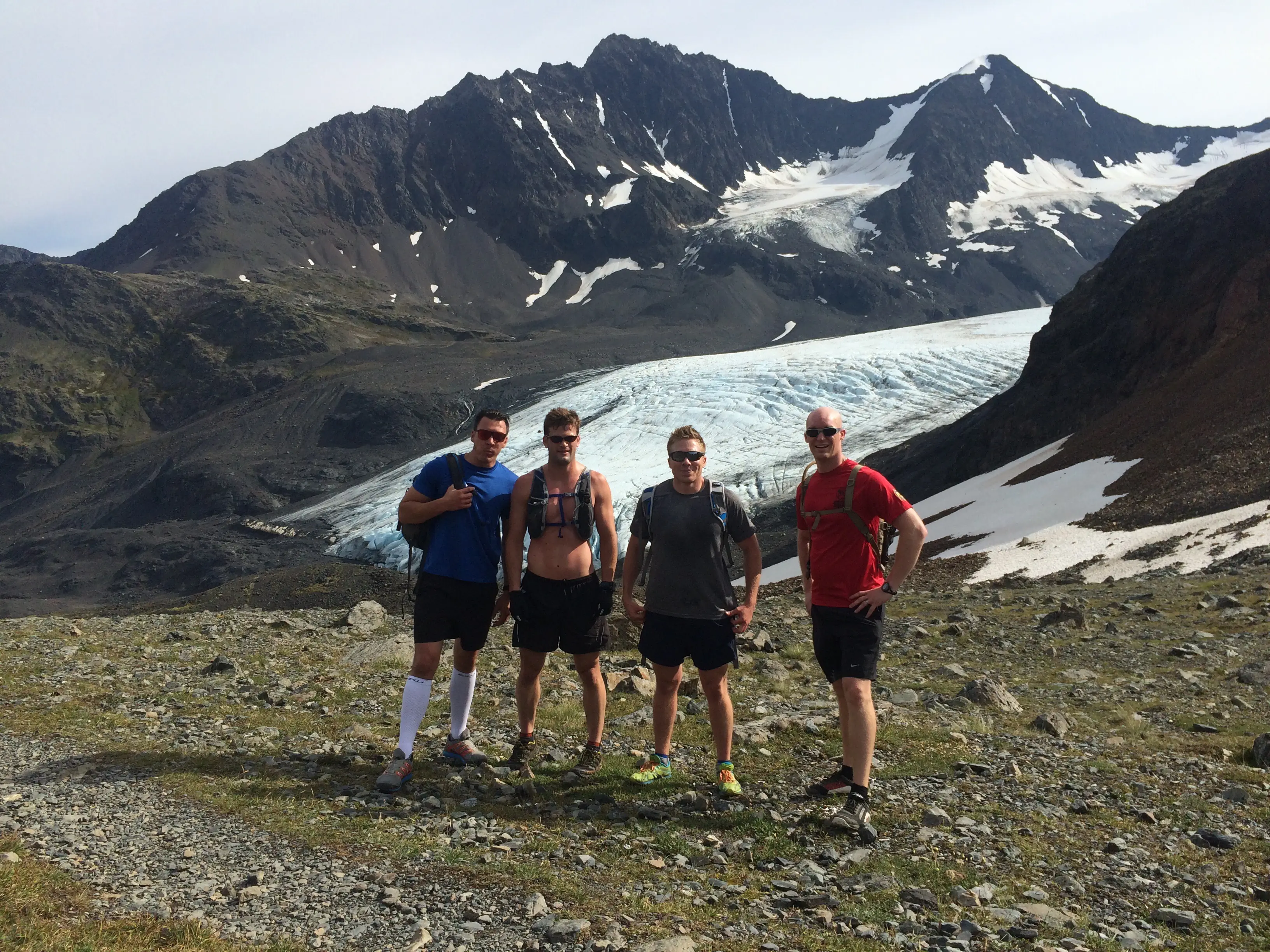 Dr. Matt with 3 others in front of glacier on hike