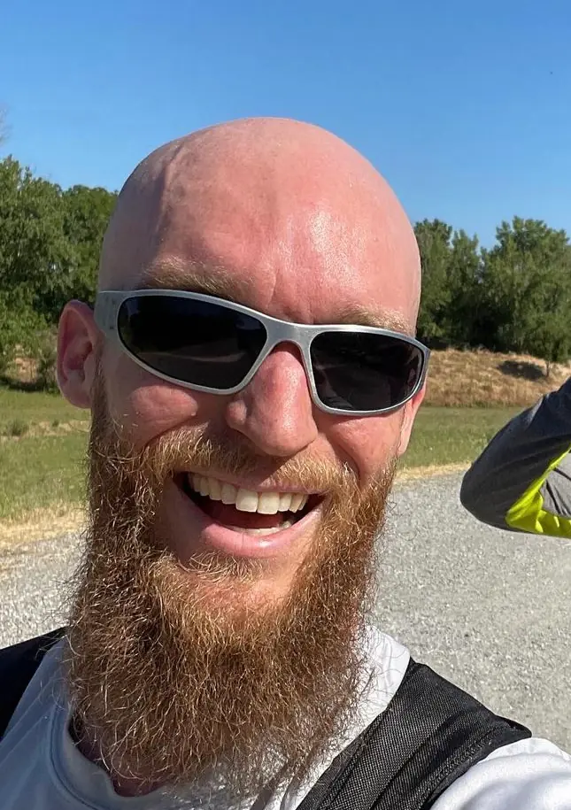 Dr. Matt smiling outdoors with sunglasses on