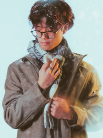 male model adjusts scarf