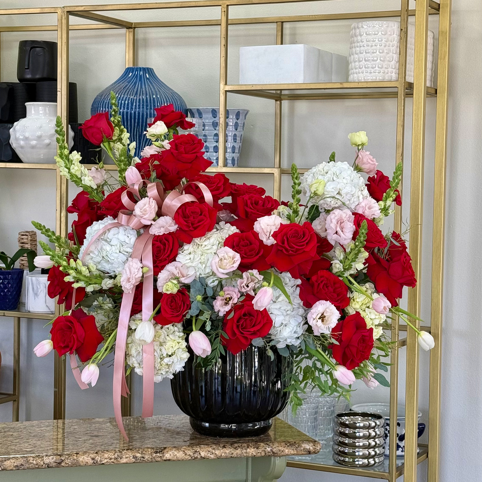 Rosé Nocturne red rose and hydrangea arrangement with blush flowers and pink tulips in a black vase