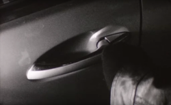 Thief stealing a car.