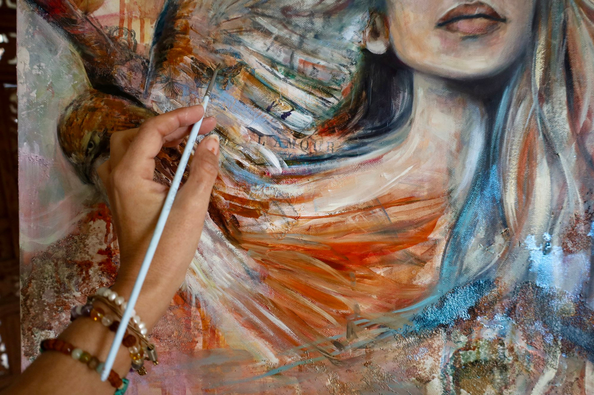 Painting of a woman with a hawk, in warm earthy tones, celebrating wild and sacred feminine energy.