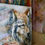 Thumbnail: Painting of a grey Yellowstone wolf standing still in soft light, symbolizing quiet strength and wild beauty.