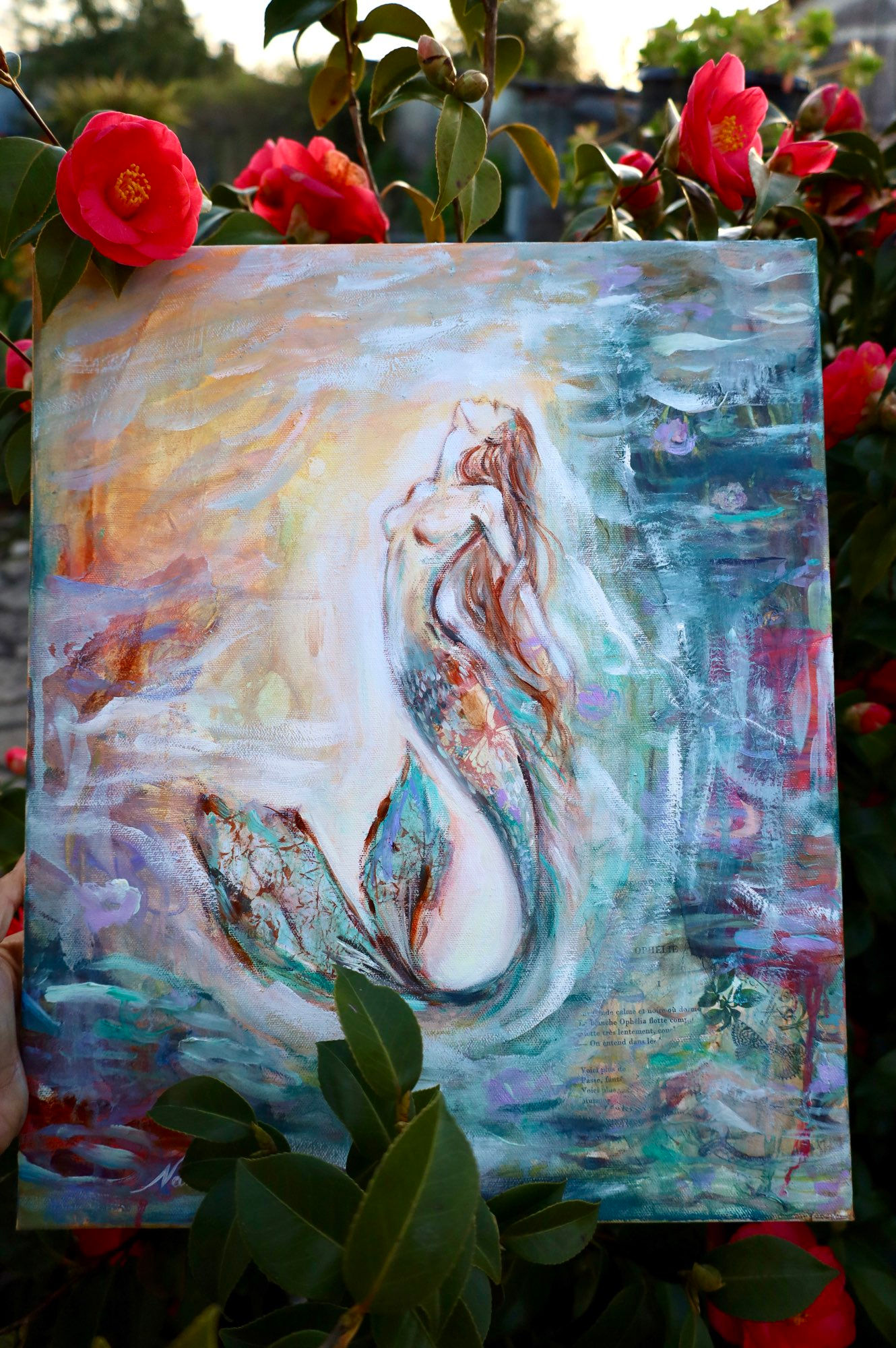 Mermaid artwork featuring flowing water, pastel tones, and collage textures, embodying feminine power and grace.