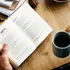 reading a book over coffee
