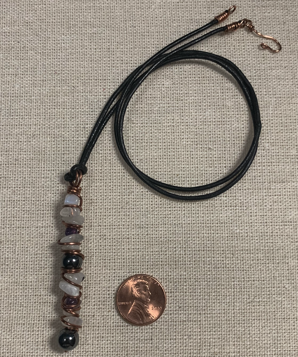 wire wrapped copper necklace. Gemstones are amethyst and moonstone.