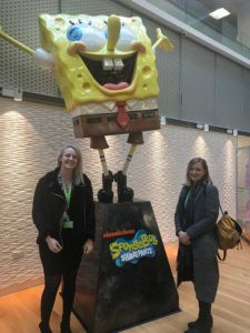 Jenna and Lynne next to a Spongbob Statue