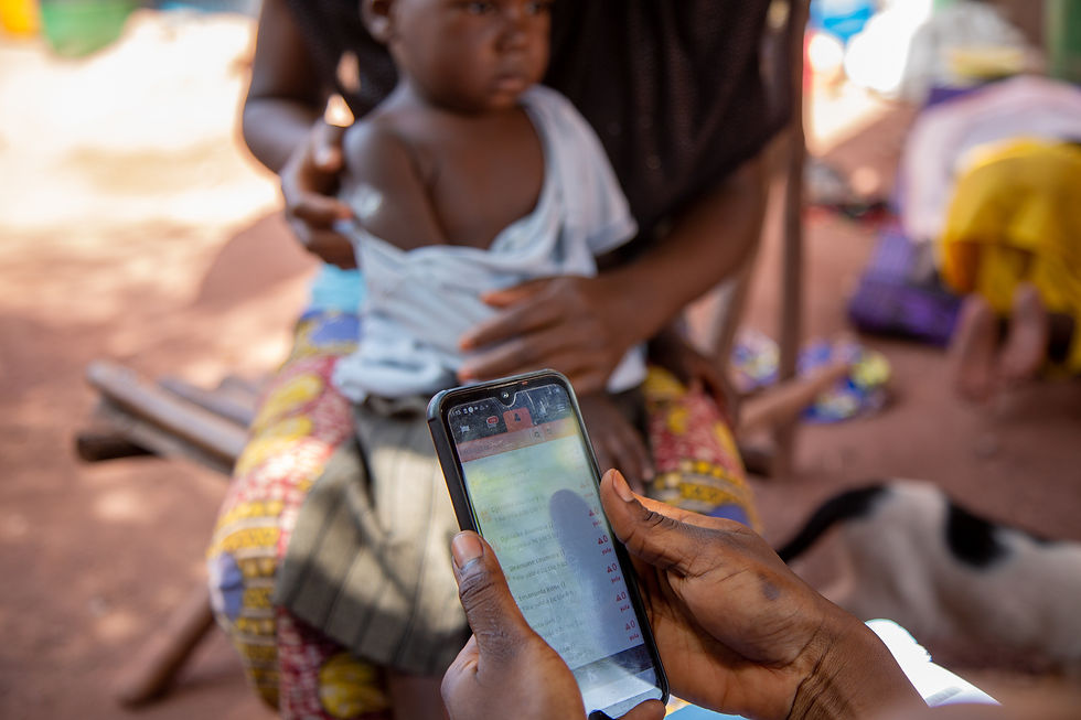 A ProCHW records a home visit in her app in Yirimadio.