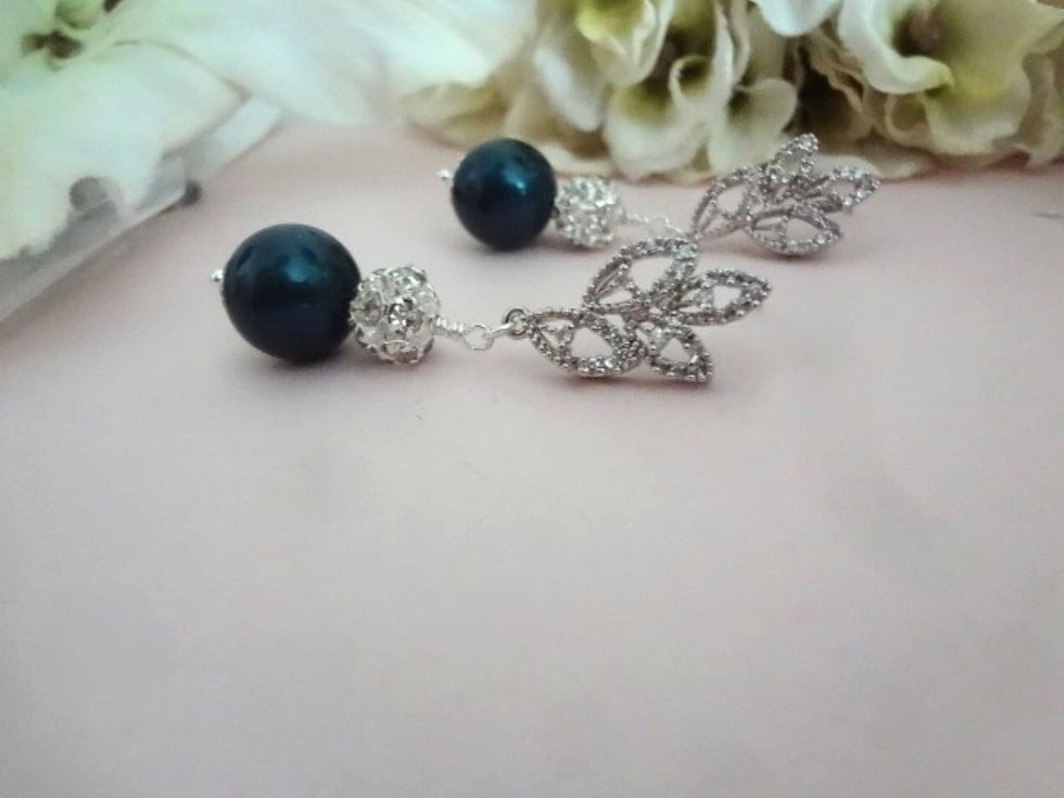 Thumbnail: Navy blue round pearl earrings with crystal round bead and cz earring posts in a leaf style motif