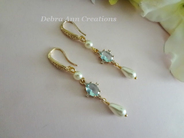 Thumbnail: Light Blue Oval CZ Crystal and Pearl Teardrop Dangle Earrings