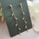 Thumbnail: Cubic Zirconia Gold Leaf Long Tassle Earrings with Teardrop Post
