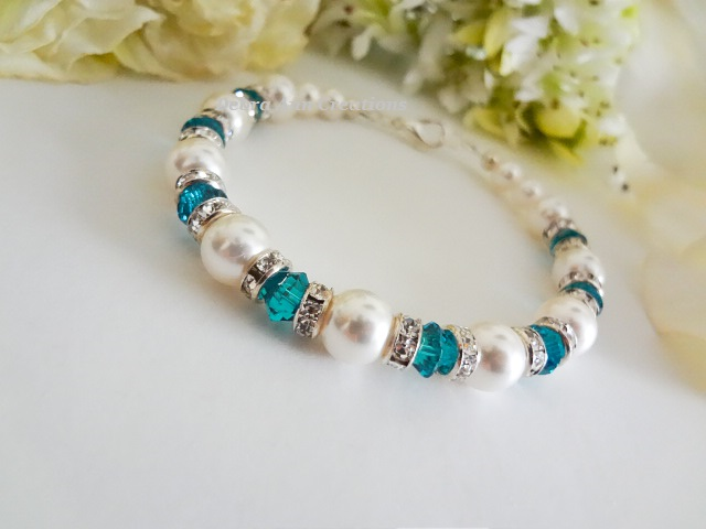 Thumbnail: December birthstone clasp bracelet with pearls and blue zircon crystals