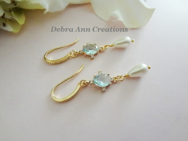Thumbnail: Light Blue Oval Crystal and Teardrop Pearl Dangle Wedding Earrings