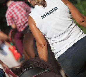 Photo of student riding horse during a holiday camp at Clearwater Bay Equestrian Centre (CEEC)