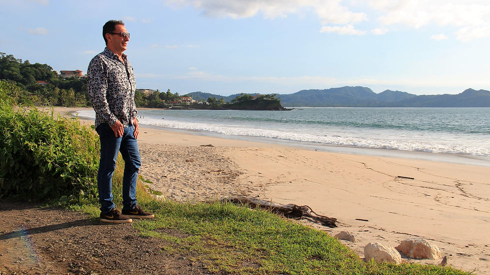 Eye-level view of a beachfront land plot in Jaco Costa Rica with ocean in the background