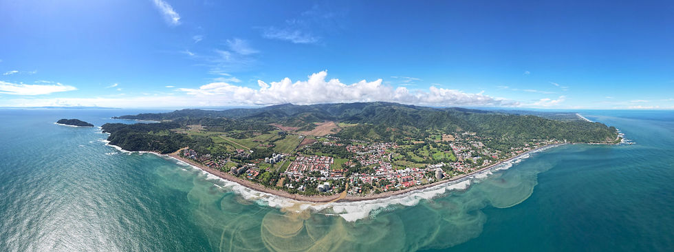 High angle view of Jaco Beach coastline with ocean and buildings