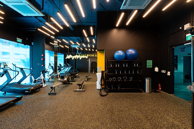 Side view of the gym at Lyf Farrer Park, showcasing the modern fitness space.