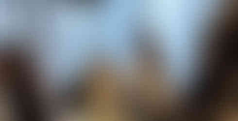 Colleagues dressed in traditional attire sharing moments of celebration and cultural appreciation at ARTG Design Group.