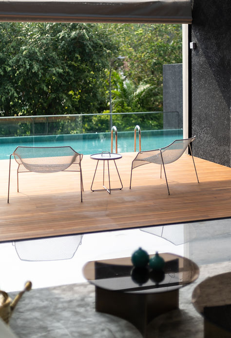 Infinity-edge pool at Camborne Villas, seamlessly blending with the lush greenery and creating a serene outdoor retreat.