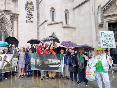 Members of Save Wimbledon Park SWP gathered in the rain outside the Royal Courts of Justice on the first day of their Court of Appeal hearing