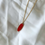 Thumbnail: Ellipse Gold Blood Orange  Pressed Flower Necklace
