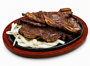 Grilled Korean galbi short ribs served on a sizzling plate