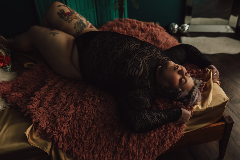 woman laying on a bed