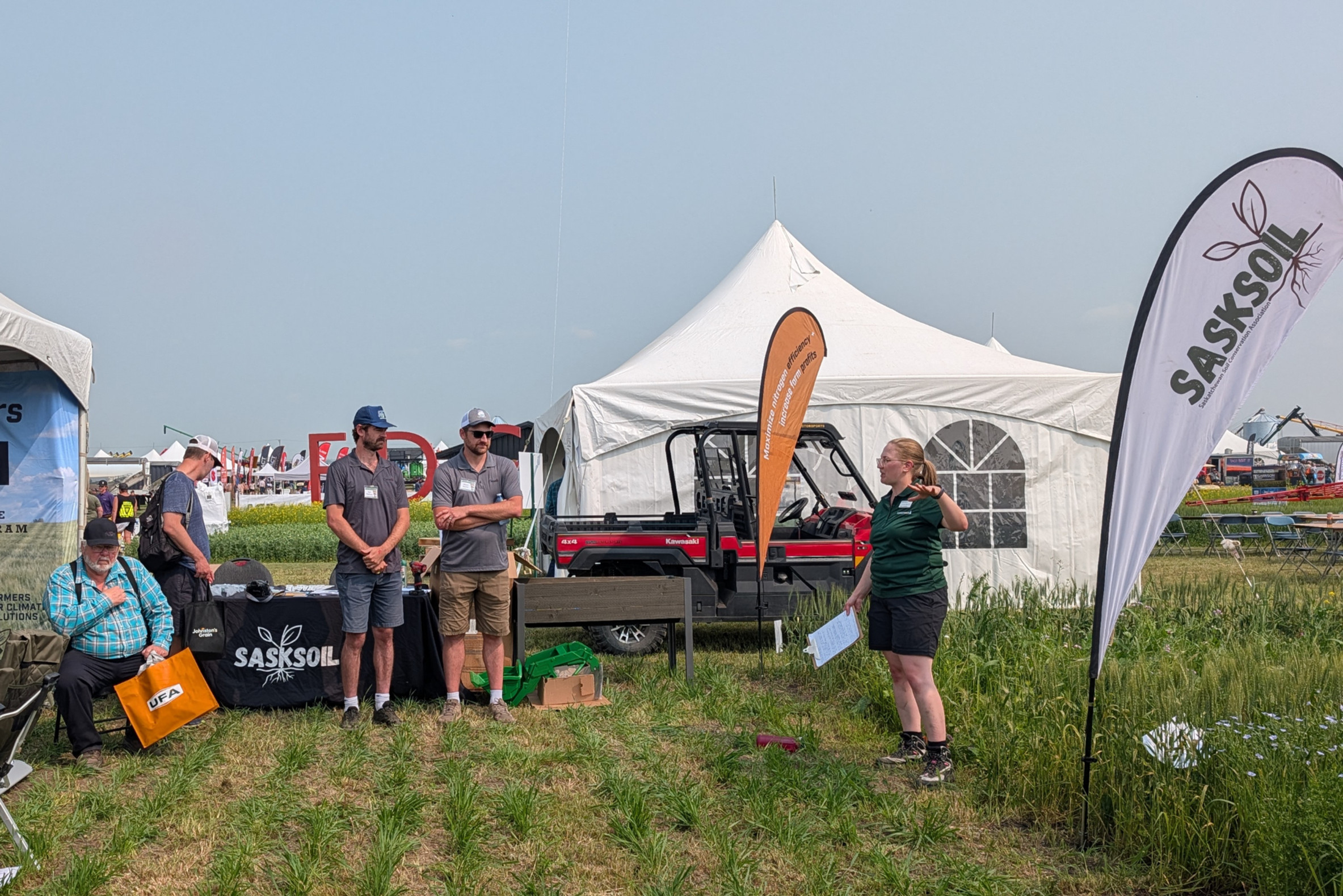 female scientist speaks to group about soil health at Ag in Motion