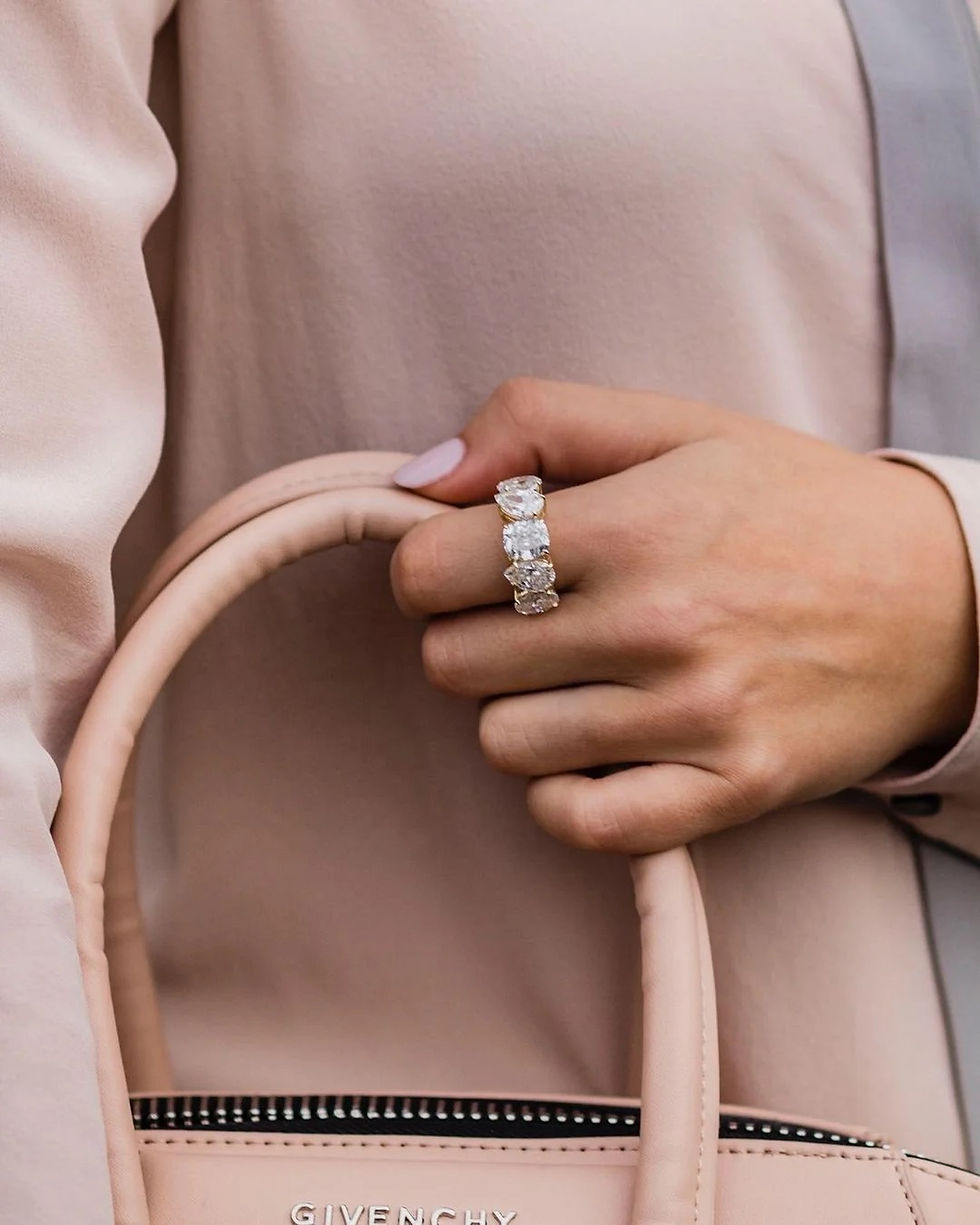 Oval, pear and cushion cut moissanite band.