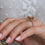 Thumbnail: Champagne moissanite with halo and half paved band