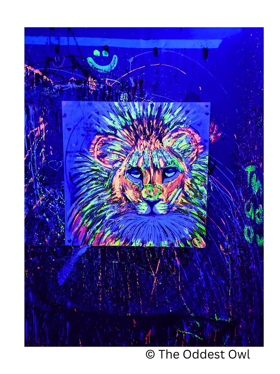 Thumbnail: Portrait of Cade, a bright yellow and neon lion painted with colorful UV pigments, set against a bright purple background wit