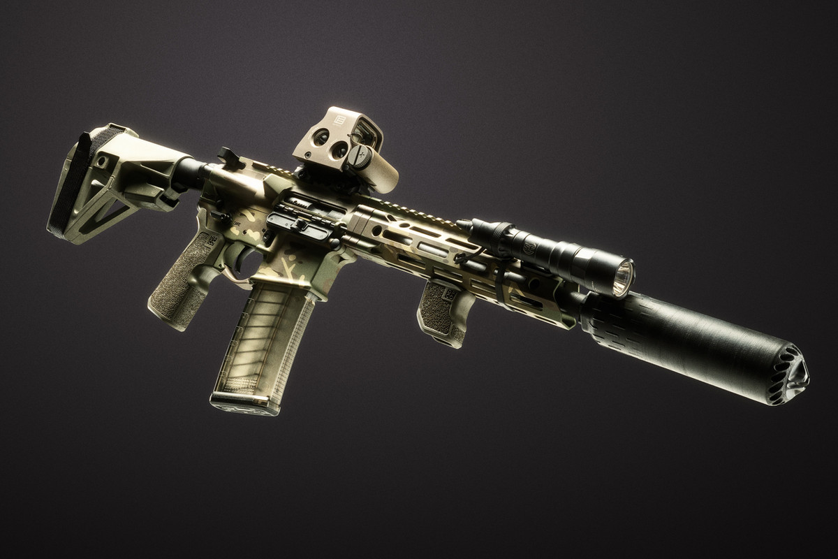 Daniel Defense DDM4 V7 Woodland 5.56 NATO pistol with green camouflage Cerakote and ODG furniture, photographed by Custom & Collectable Firearms