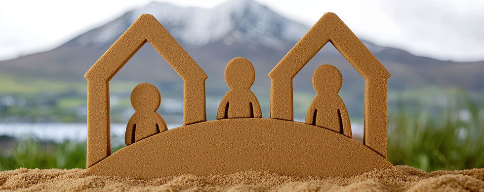 sand-sculpture-three-figures-houses-symbolizing-family-unity.jpg