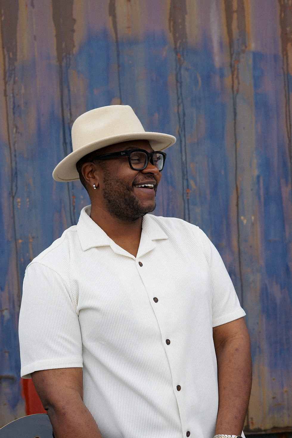 Event host speaking on stage during a professionally produced corporate event.