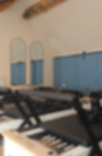 Close-up view of Pilates reformer springs and carriage