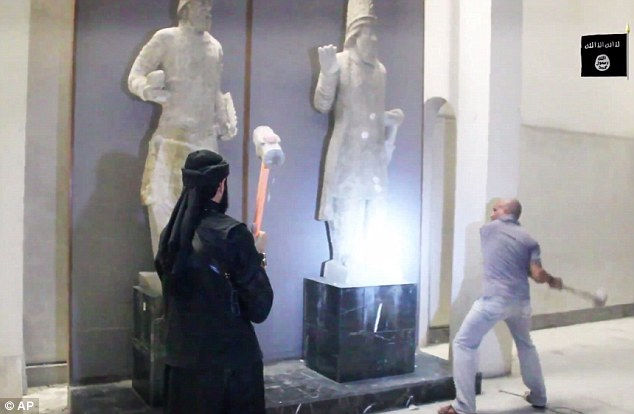Extremists used sledgehammers and power drills to smash ancient artifacts at a museum in the northern city of Mosul