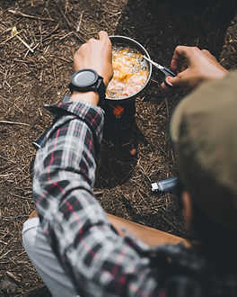 Camper Preparing Meal