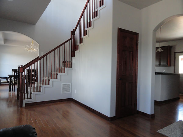 Open dining, stairway, and kitchen area in the Lawrence & Jalita home, Montrose, CO
